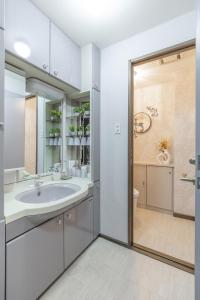 a bathroom with a sink and a shower at Cozy Stay Kamui in Asahikawa +112 photos