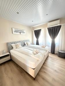 Giường trong phòng chung tại Guesthouse Zornitsa