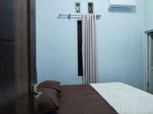 Postel nebo postele na pokoji v ubytování D'corner Homestay