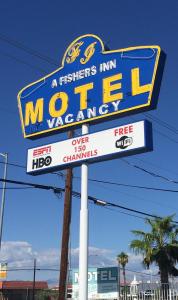 Una señal para un motel de la posada Michigan en A Fisher's Inn Motel, en Las Vegas