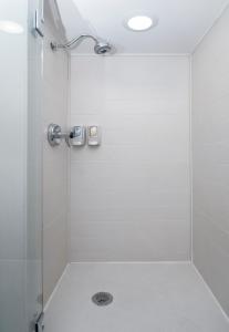 a shower with a glass door in a bathroom at Best Western Travelers Rest/Greenville in Travelers Rest