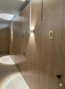 a bowling alley with a light on the wall at Zam Zam Hostel in Bishkek