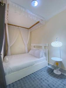 En eller flere senge i et værelse på Beautiful Spaces Haven