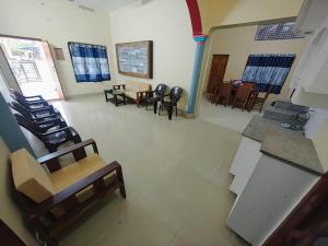 an overhead view of a room with chairs and tables at Elixir Mansion in Jāmb