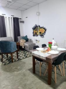 a living room with a table and a couch at Seven S villa in Kamburugamuwa +1 photo