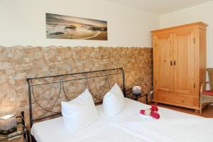 Giường trong phòng chung tại Landhaus zum Strande - 44-07