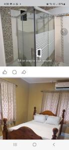 ein Schlafzimmer mit einem Bett und einem Spiegel in der Unterkunft Dream Big Accommodation in Apia