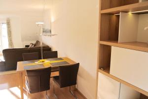 a small dining room with a table and chairs at Alexandra - 13-20 in Kühlungsborn