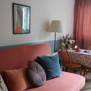 a living room with a couch and a table at Wygodne mieszkanie dla dwojga in Bystrzyca Kłodzka +14 photos