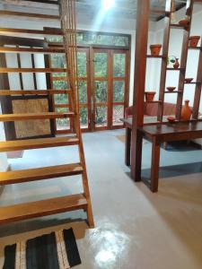 En eller flere senge i et værelse på Ella EDAN Homestay