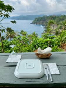 a table with a sink and a view of the ocean at 7 Ventos in Alto Douro