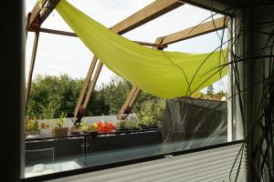 a window with a hammock on a balcony at Close to Goettingen - unweit von Göttingen in Nörten-Hardenberg