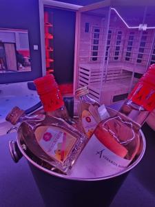 two bottles of wine sitting on top of a counter at Apartman Fantazy spa BDSM in Novi Grad