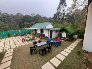 an overhead view of a house with chairs and tables at Bethel Cottage in Kanthalloor +9 photos