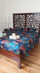 a bedroom with a bed with a colorful comforter at Casa do Beco in Lisbon