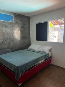 Giường trong phòng chung tại Casa cidade universitária