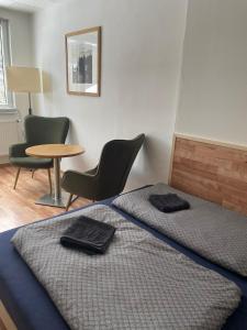 Giường trong phòng chung tại Malý apartmán na Šumavě