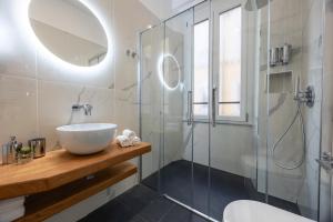 a bathroom with a sink and a shower at SM Vatican Relais B&B in Rome +54 photos