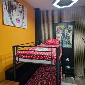 En eller flere senge i et værelse på Balacobaco