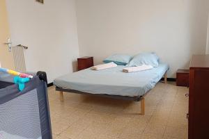 a bedroom with a bed and a tv in it at Spacious house in Perpignan quiet and friendly in Perpignan