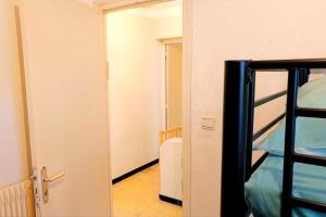 an open door to a room with a bed at Spacious house in Perpignan quiet and friendly in Perpignan +6 photos