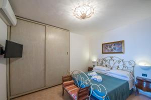 Giường trong phòng chung tại Casa Il Riccio