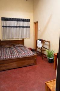 En eller flere senge i et værelse på Yashora Gimanhala