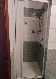 a shower with a glass door in a bathroom at Fronte mare Porto Vecchio in Lampedusa