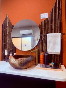 a mirror sitting on top of a shelf with a bowl at Pine Leaf lnn 楓の宿 2号館 in Osaka +68 photos