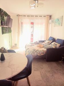 Postel nebo postele na pokoji v ubytování Charmant F1 près tramway et plage + 25 fotografií