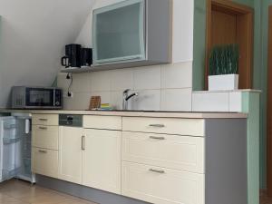 Kuchyň nebo kuchyňský kout v ubytování Magdalena Apartment 2 + 2 fotografie