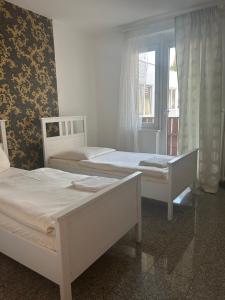 Postel nebo postele na pokoji v ubytování Apex City Apartment