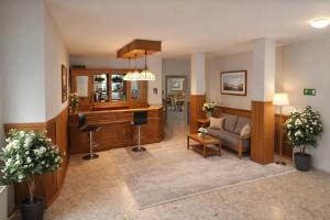 a living room with a couch and a table at Pension Ursula in Pfaffstätten