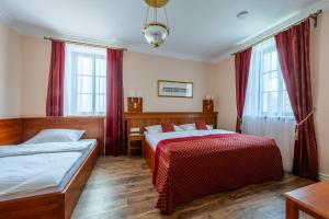 Postel nebo postele na pokoji v ubytování Penzion Pod Krásnou horou