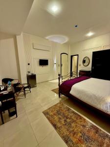 a bedroom with a bed and a living room at Nile Castle in Luxor +41 photos