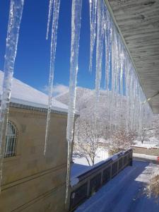 a group of icicles hanging from the side of a building at Heaven apartment in Gabala