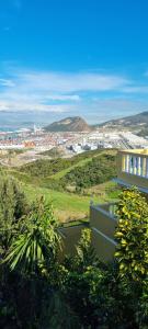 a house on a hill with a view of a city at Horizon heights in El Haouma