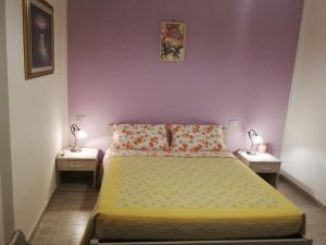 En eller flere senge i et værelse på B&B RIPALTA