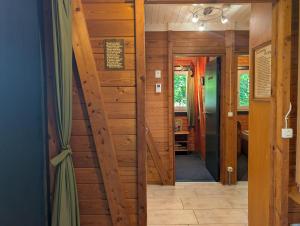 a hallway in a house with wooden walls at Kysthus in Damp