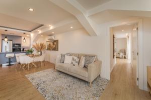 a living room with a couch and a table at The Viewpoint by Eurostay in Ribeira Brava