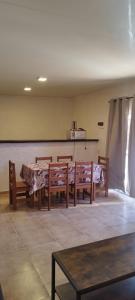 a dining room with a table and benches in a room at Terrazas al Sol 03 in Playa Hermosa +8 photos