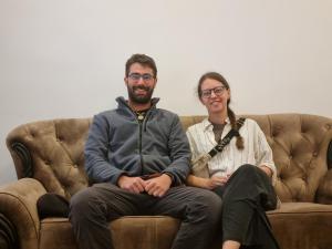a man and a woman sitting on a couch at Astoria Cottage in Nuwara Eliya