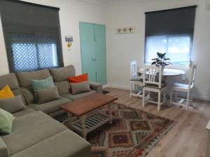 a living room with a couch and a table at Villasultana 1 in Chipiona