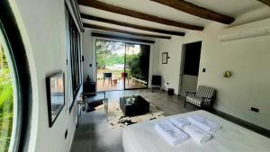 a bedroom with a bed with two towels on it at Hato San Pablo in Guayabal +160 photos