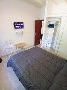 เตียงในห้องที่ Casa Parque Playa +14 ภาพ