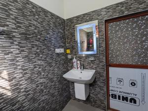 a bathroom with a sink and a mirror at Villa 505 Induruwa in Induruwa +22 photos