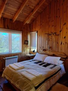 Postel nebo postele na pokoji v ubytování Parajes del Lejano sur Cabaña El Choique