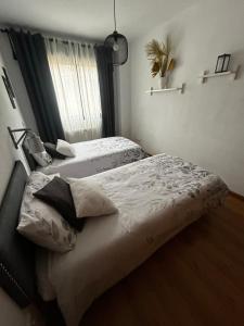 En eller flere senge i et værelse på El Rincón del Pisuerga con Terraza