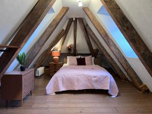 a bedroom with a bed in the attic at Reval Residences Old Town in Tallinn