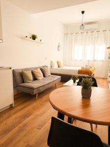a living room with a couch and a table at Genesis-Loft San Enrique 20 in Madrid